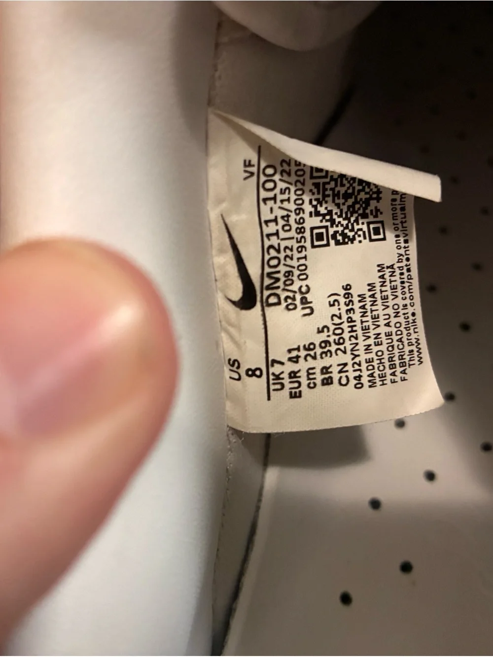 Nike White Low-Top Sneakers with Black Swoosh Tag